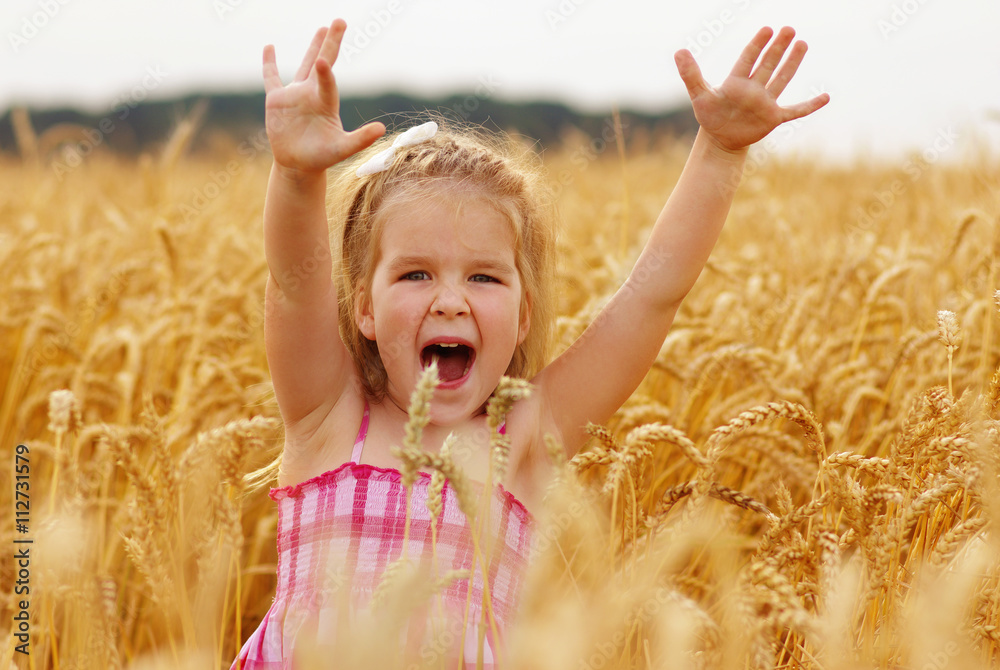 Girl on a wheat field