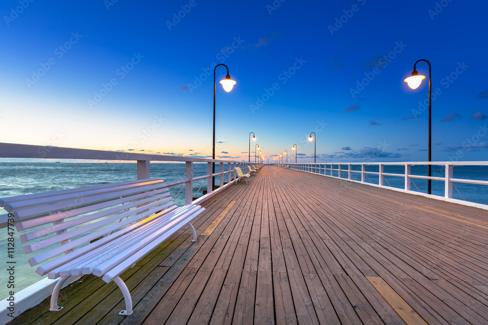 Wooden pier in Gdynia Orlowo at sunrise, Poland