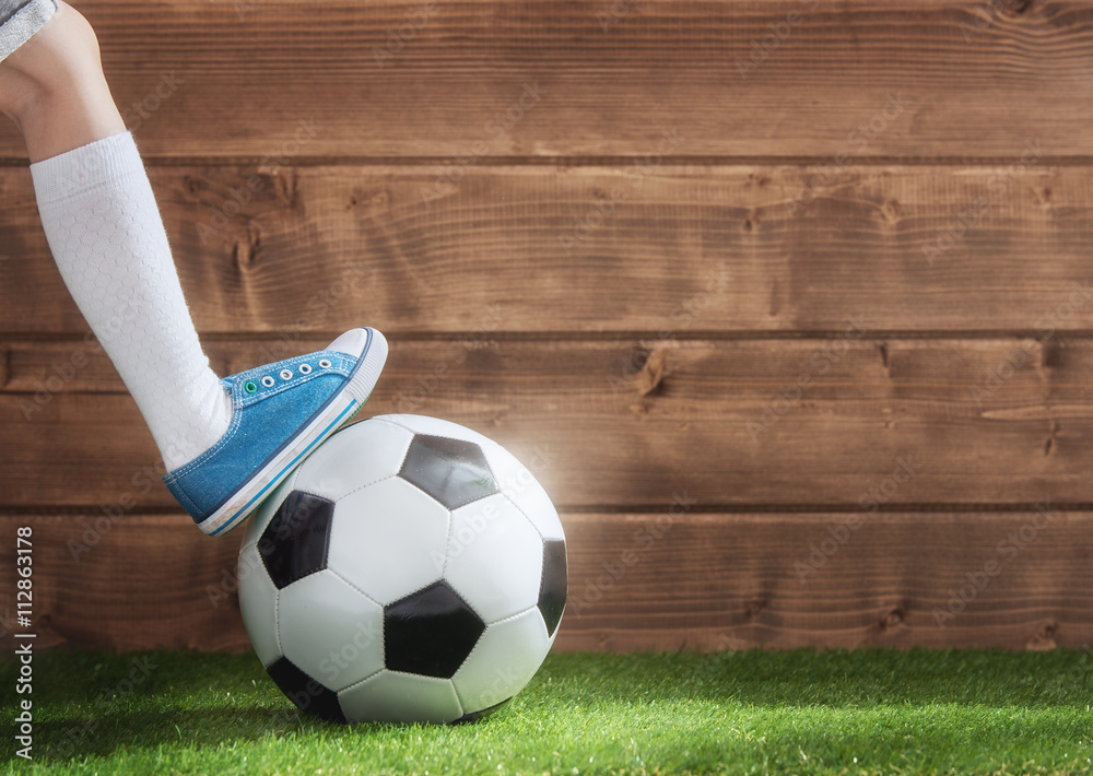 Child plays football.