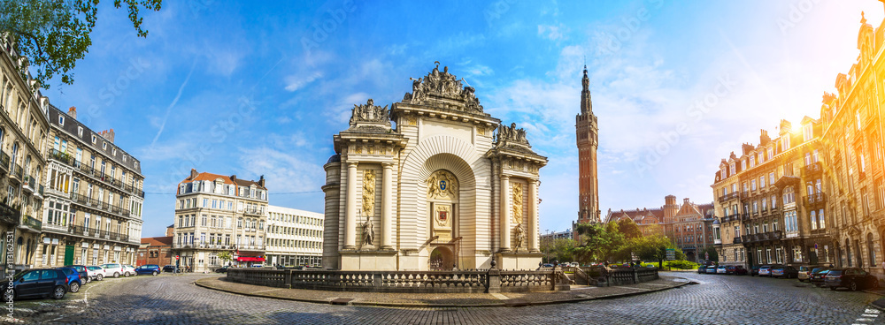 View of french city Lille with belfry, council hall and Paris’ gate