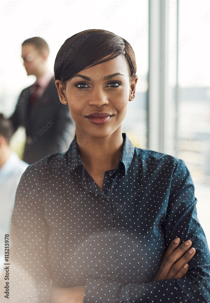 Confident young business woman in office