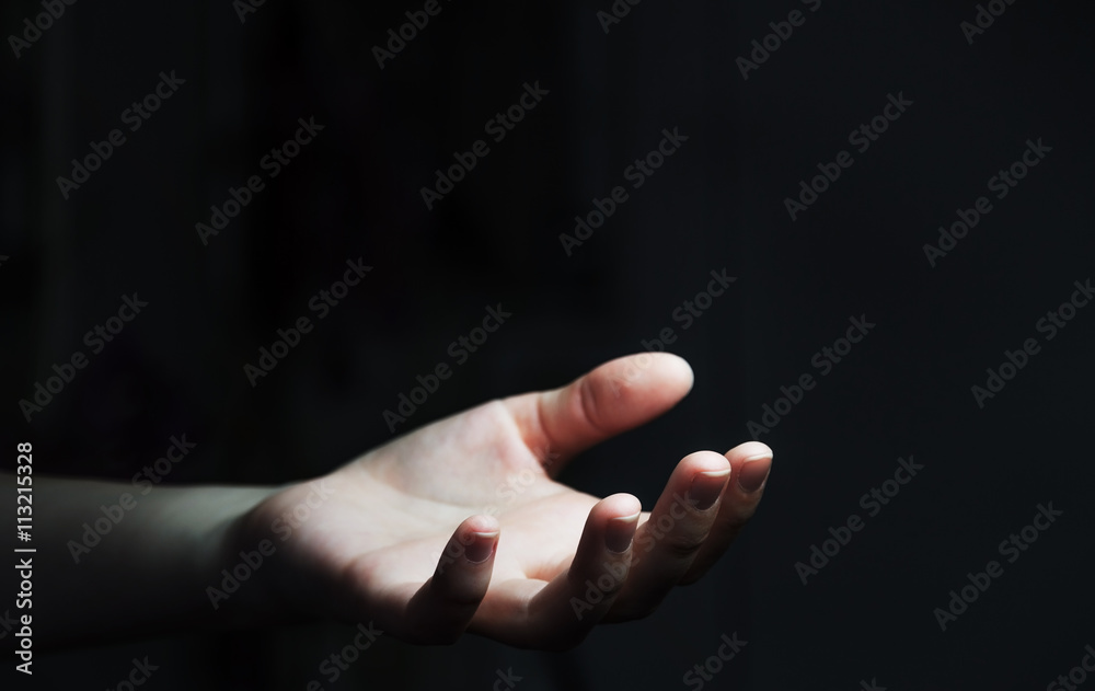 Businesswoman hand on black dark background