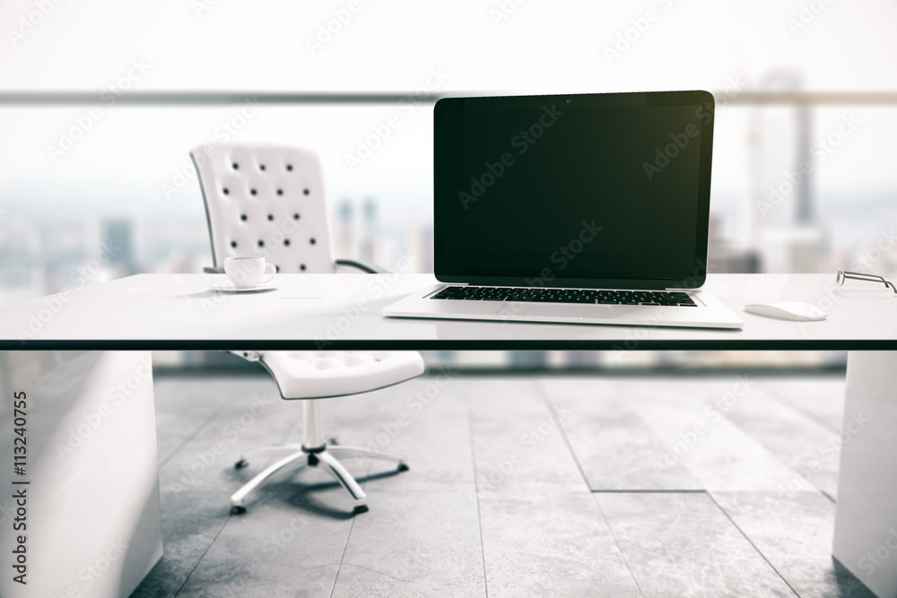 Blank laptop in office