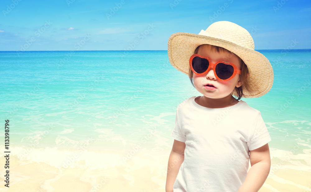 Toddler girl playing at the beach