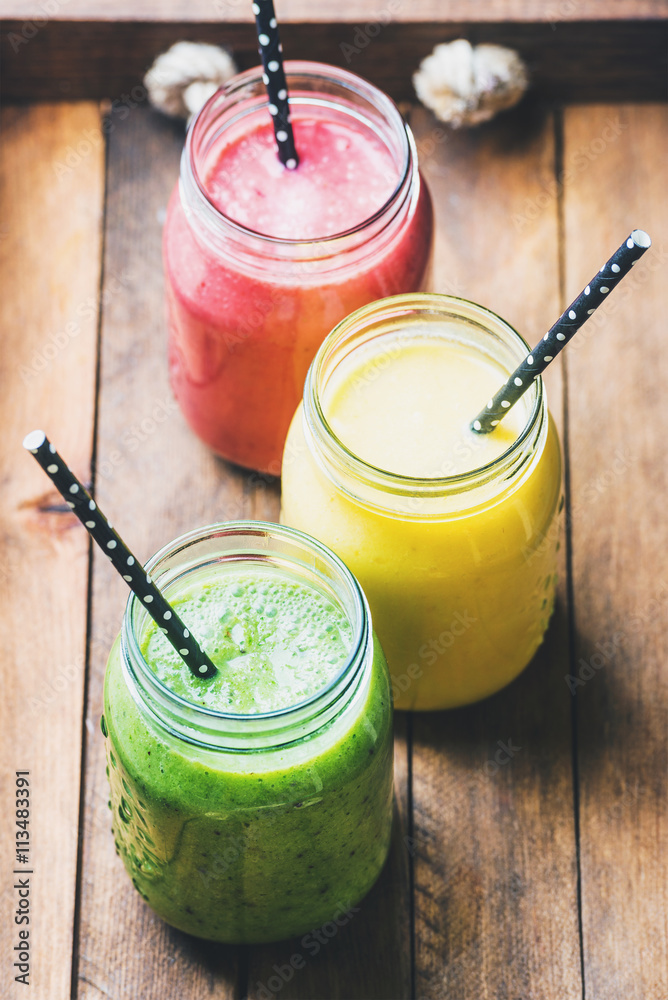 Freshly blended fruit smoothies of various colors and tastes