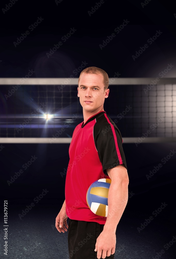 Composite image of sportsman holding a volleyball