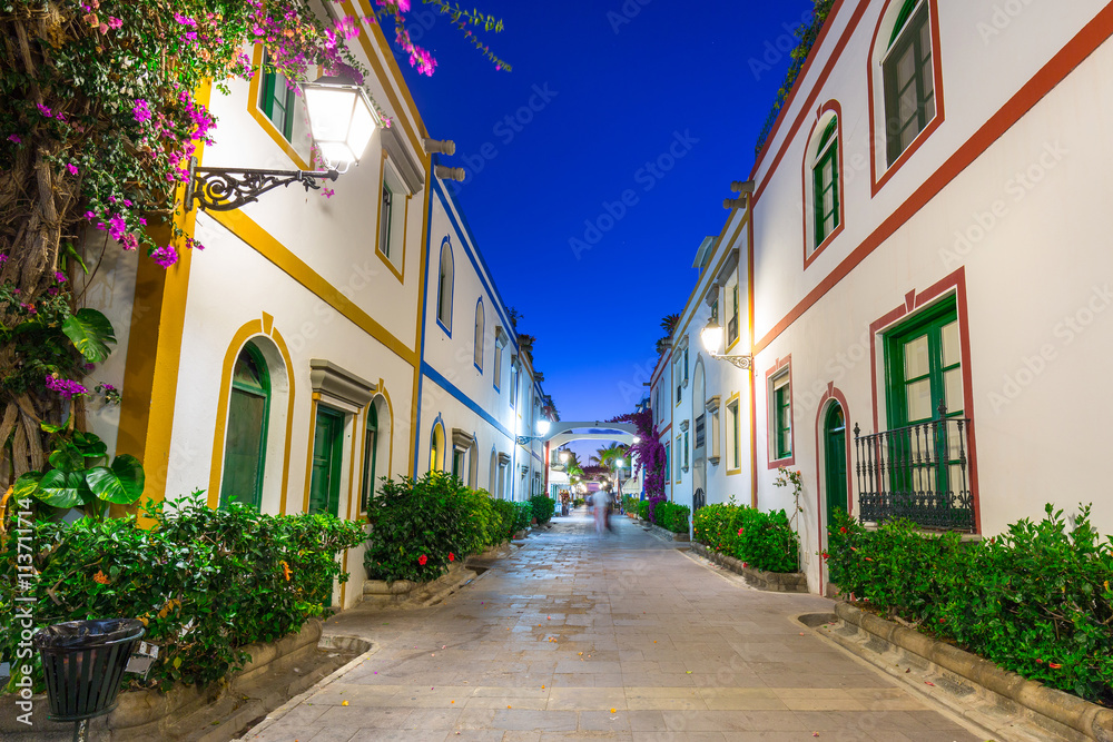 Architecture of Puerto de Mogan at night, a small fishing port on Gran Canaria, Spain.