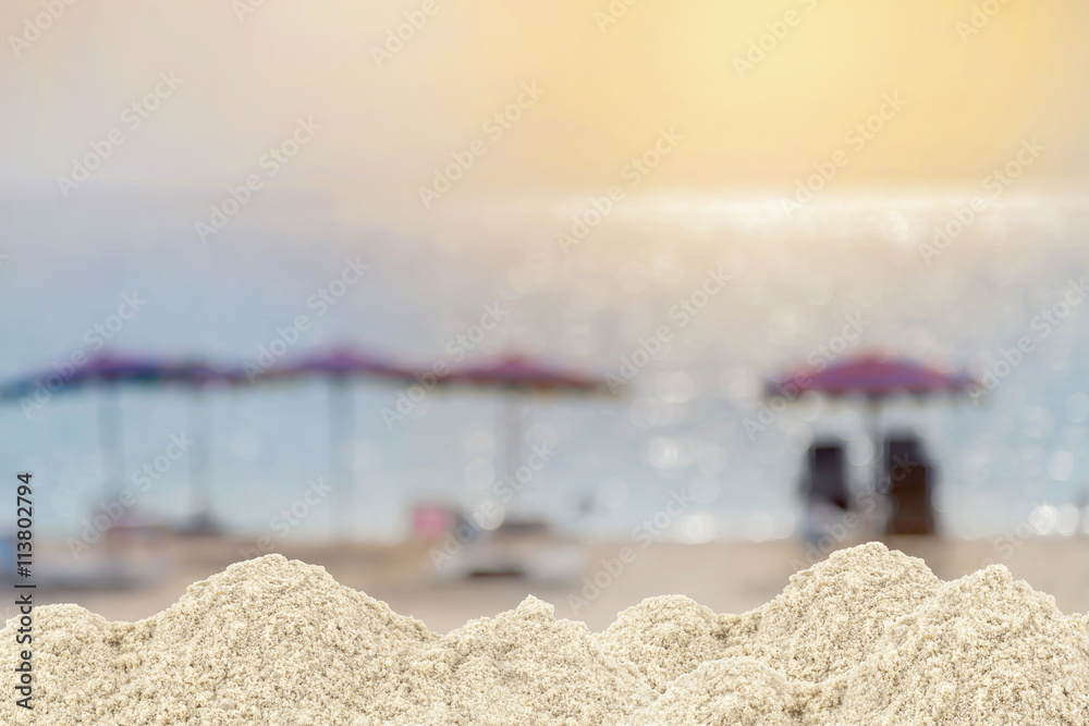  Pile of sand on blurred umbrella ,Beach chair on beach for back