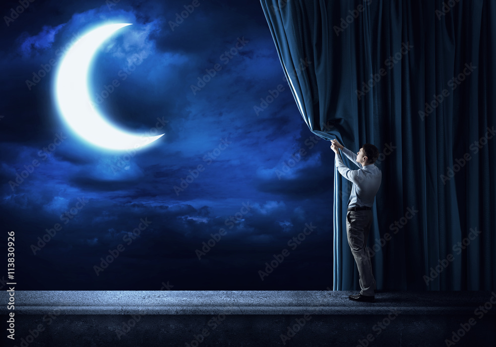 Night sky behind curtain