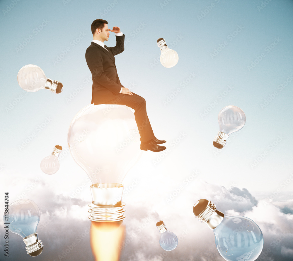 Businessman on rocket lightbulb