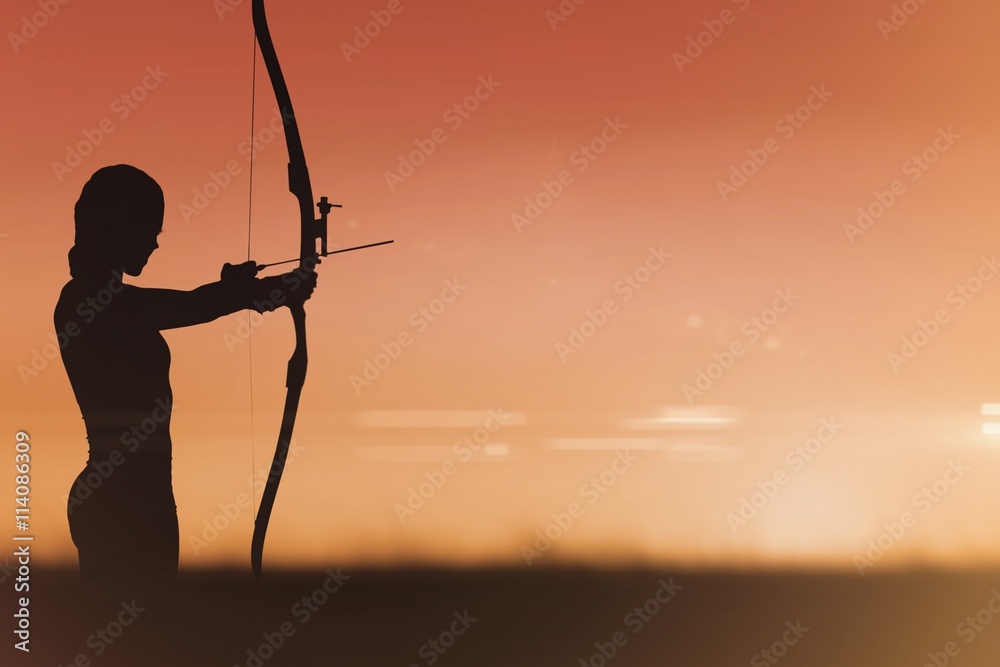 Side view of woman practicing archery