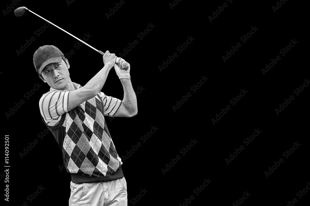 Portrait of golf player taking a shot 