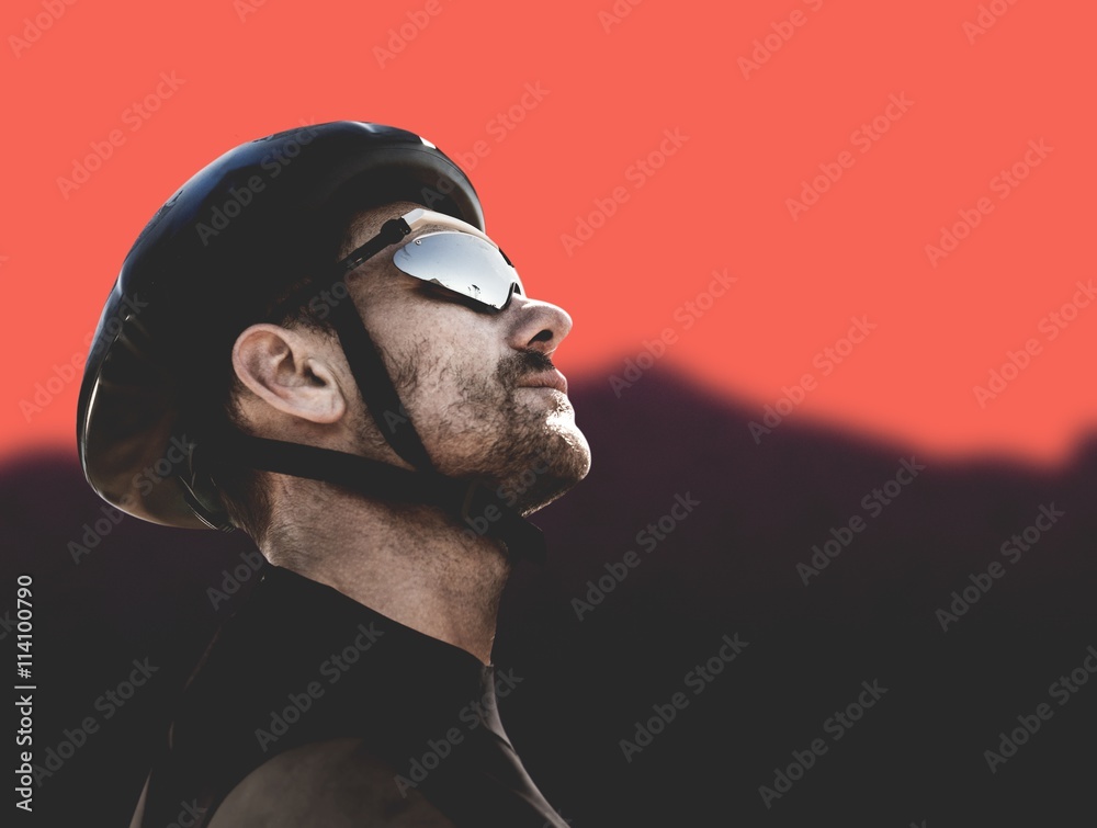 Composite image of man wearing a helmet