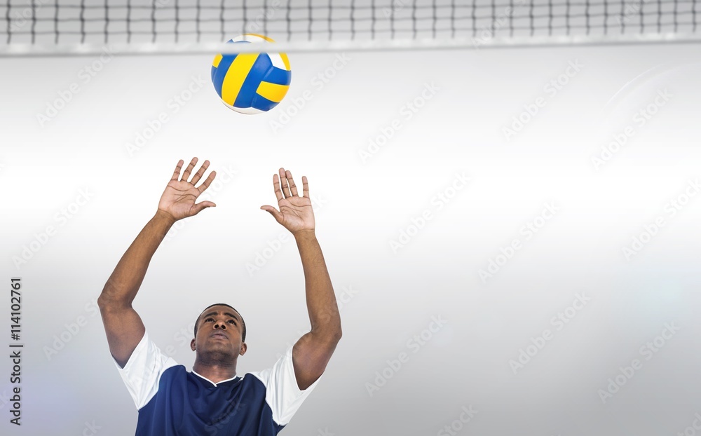 Composite image of sportsman playing volleyball