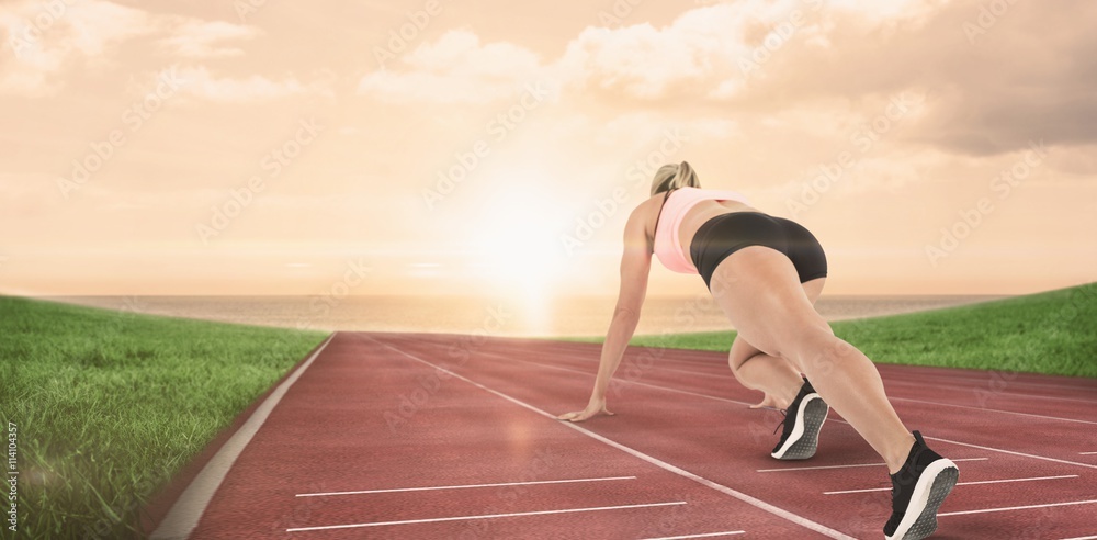 Composite image of female athlete on the start line