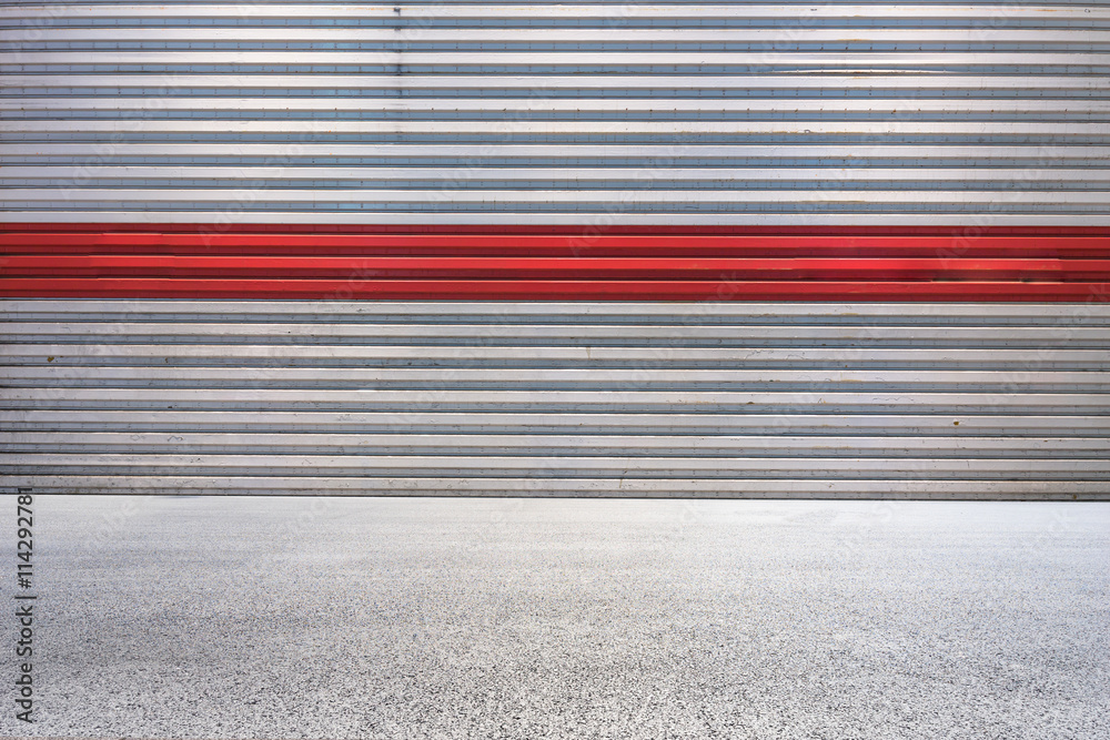 empty concrete road with pattern wall