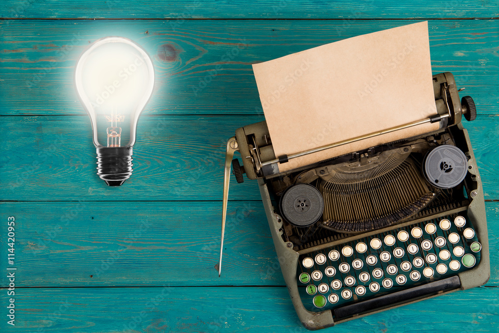 Idea concept- Vintage bulb and typewriter