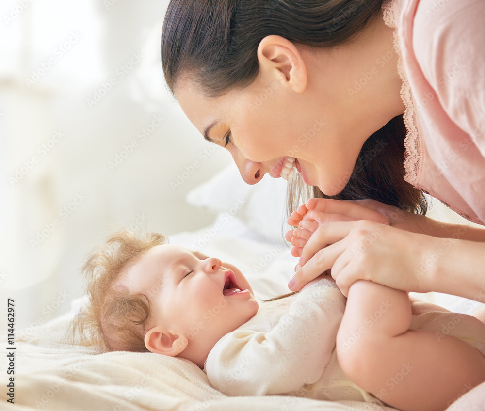 mother playing with her baby