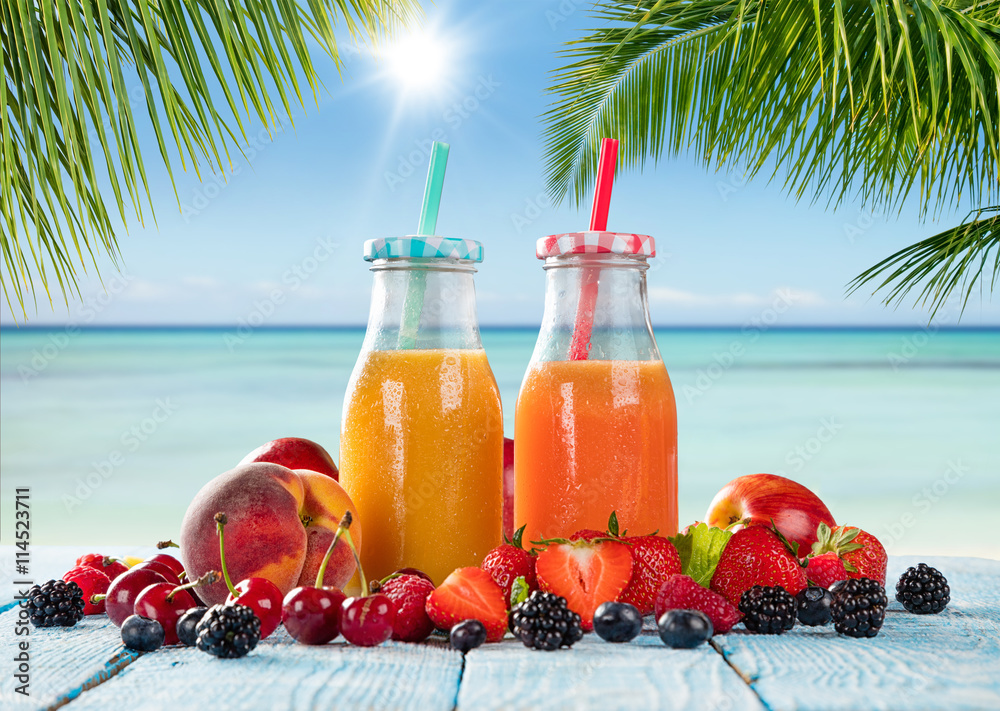 Fresh juice with fruit mix on the beach