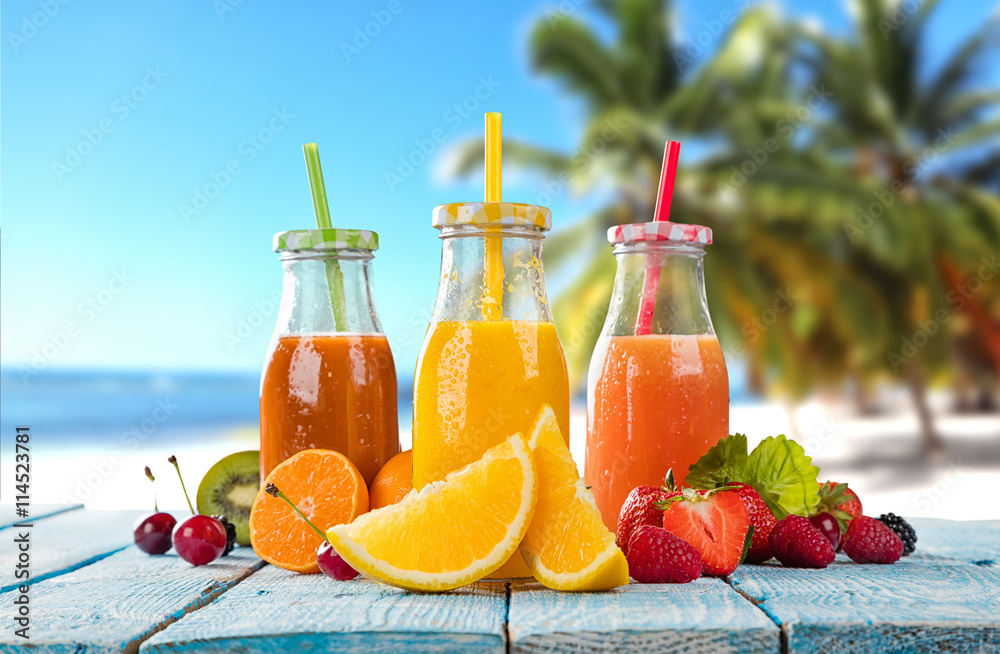 Fresh juice with fruit mix on the beach