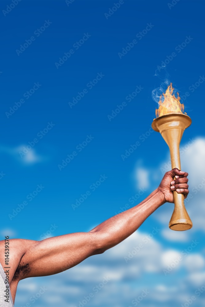 Composite image of front view of happy sportsman holding a cup 