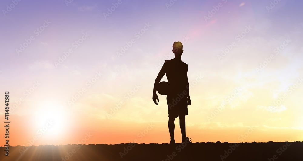 Composite image of sportsman holding a basketball