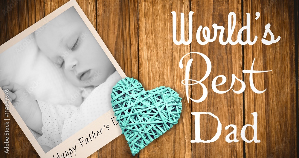 Composite image of sleeping baby and fathers day word