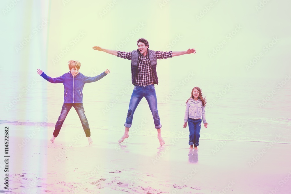 Father enjoying with children at sea shore