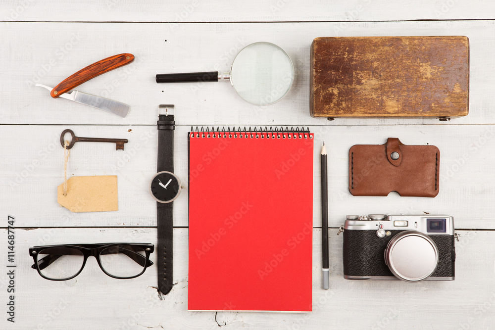 travel concept - set of cool stuff with camera and other things on wooden table