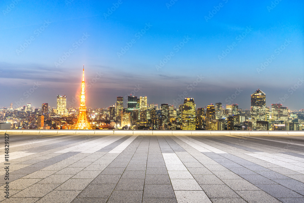 empty street with cityscape and skyline of tokyo at twilight