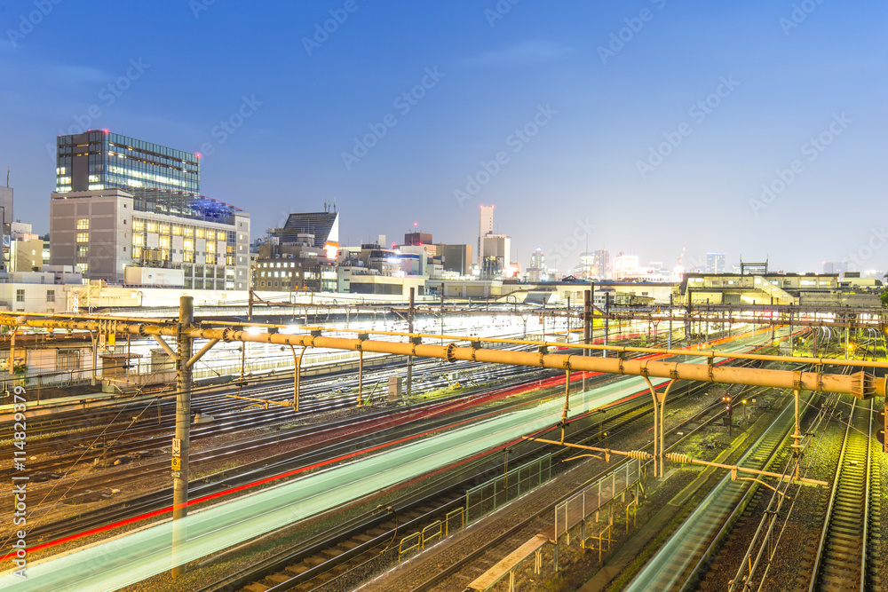 tracks in tokyo railway station at twilight