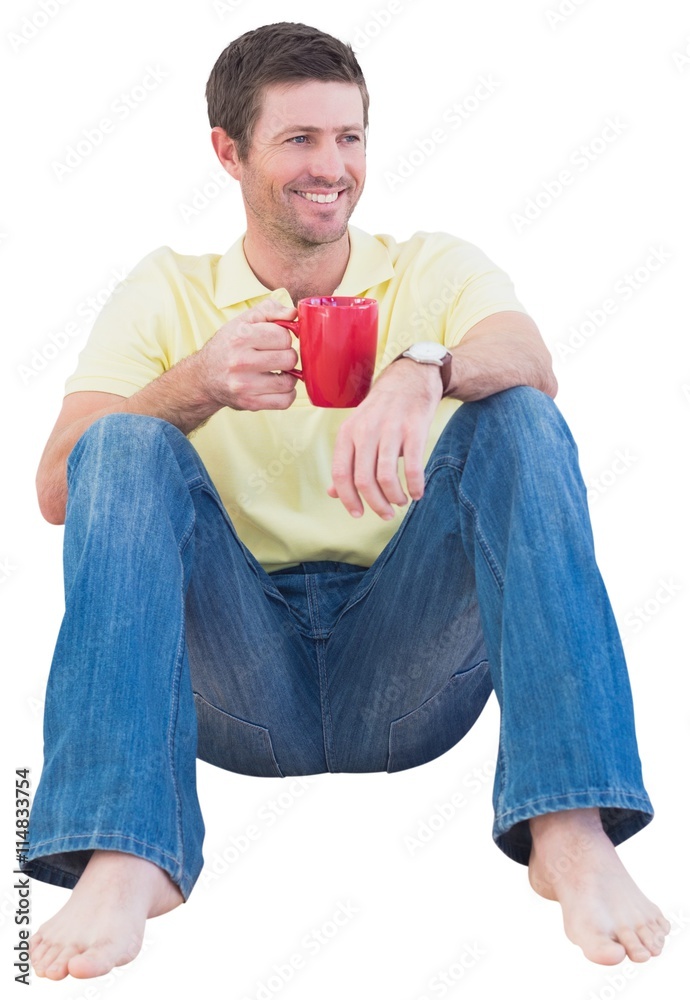 Smiling man drinking coffee