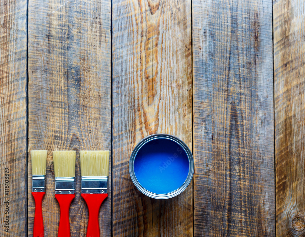 concept preparation for painting with can of blue paint