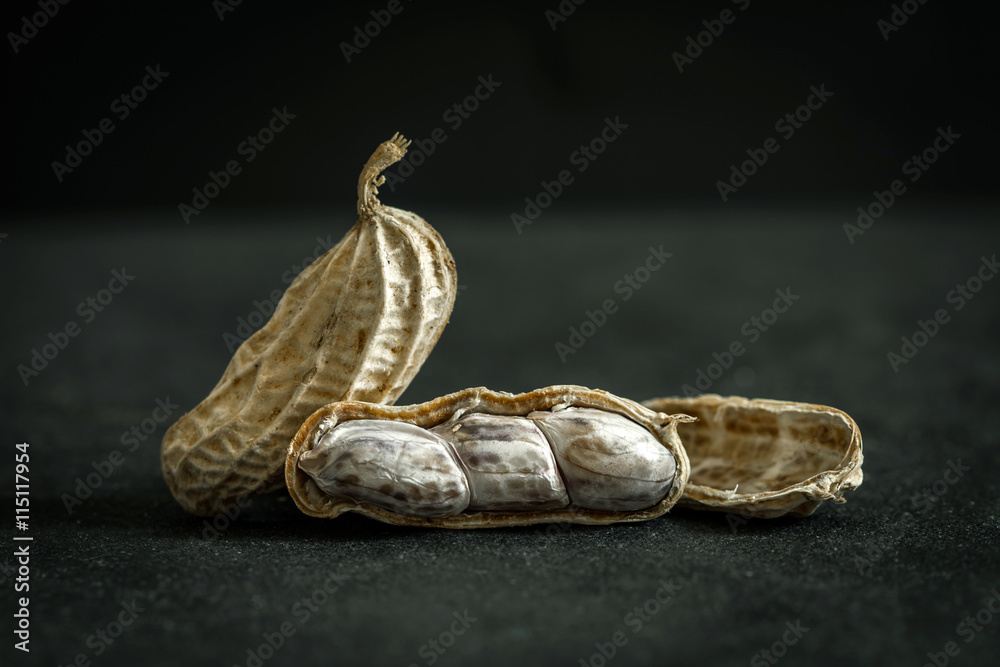 close up boiled peanuts arrange on  black stone background