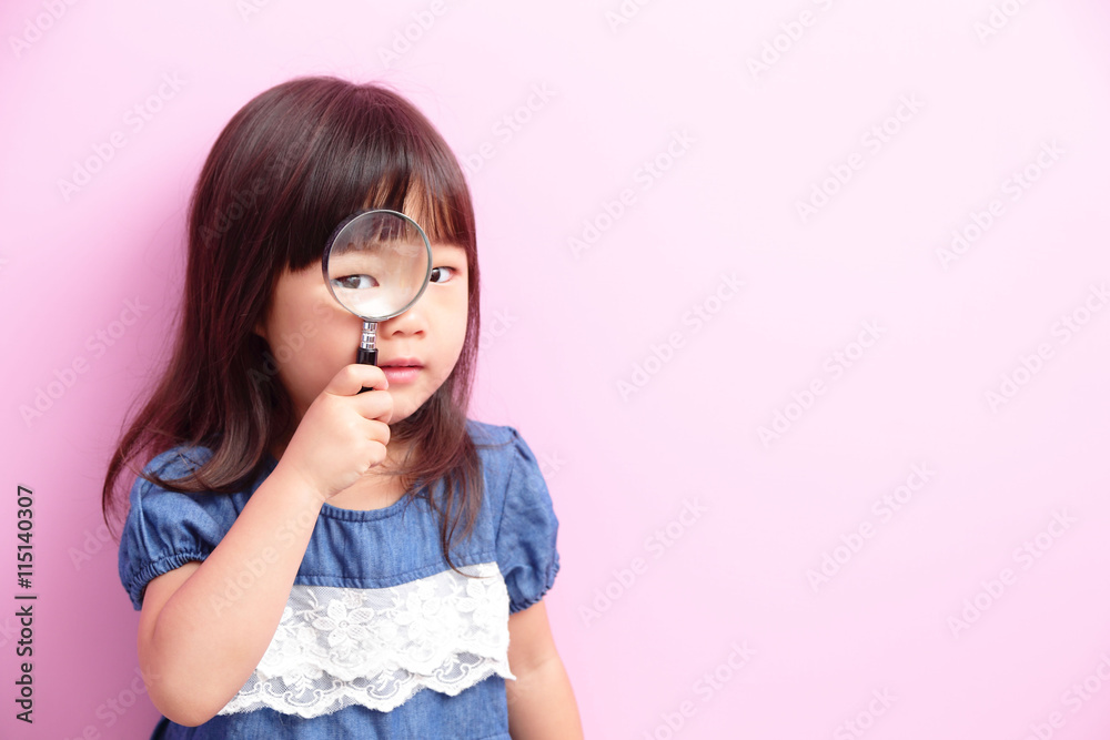  little girl holding magnifying