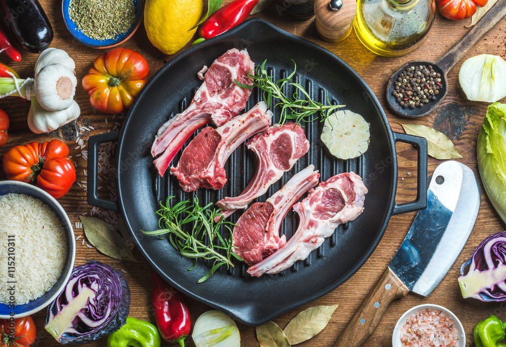 Ingredients for cooking healthy meat dinner. Raw uncooked lamb chops in iron grill pan with vegetabl