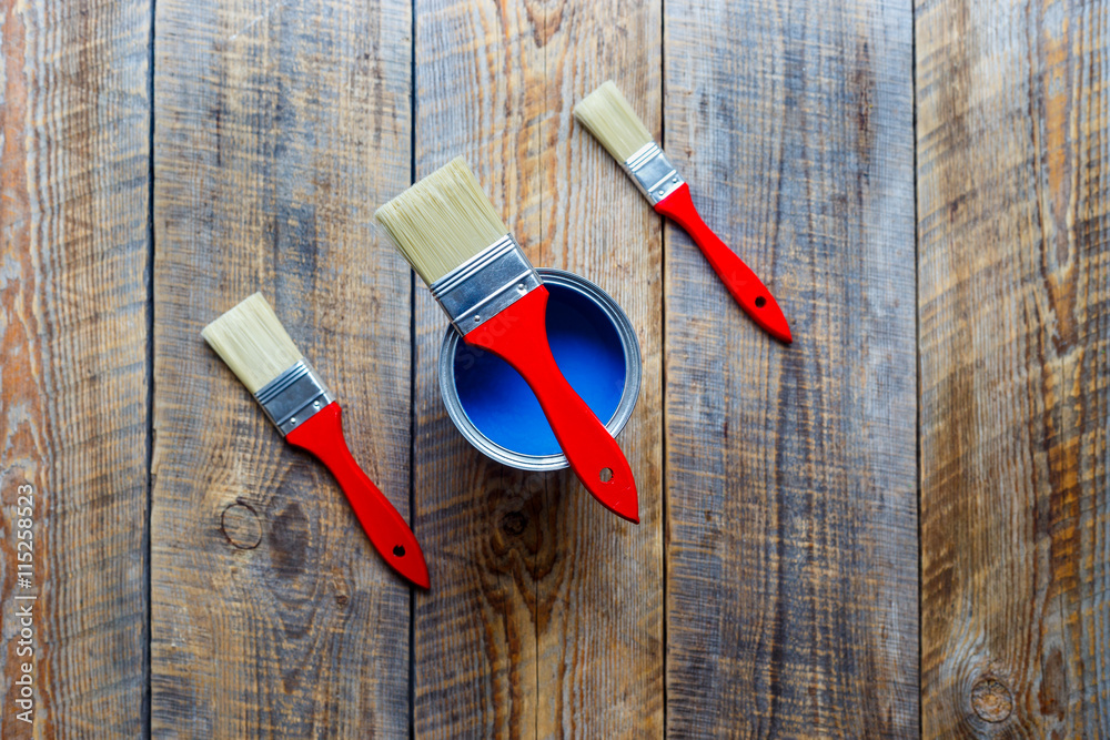 preparation for painting wooden floor at home with blue paint