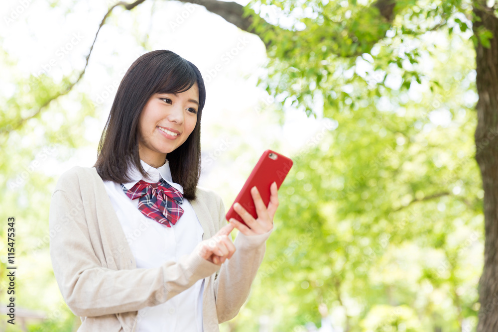 portrait of asian schoolgirl in the park