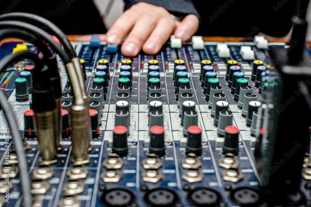 DJ audio mixer operates with one hand