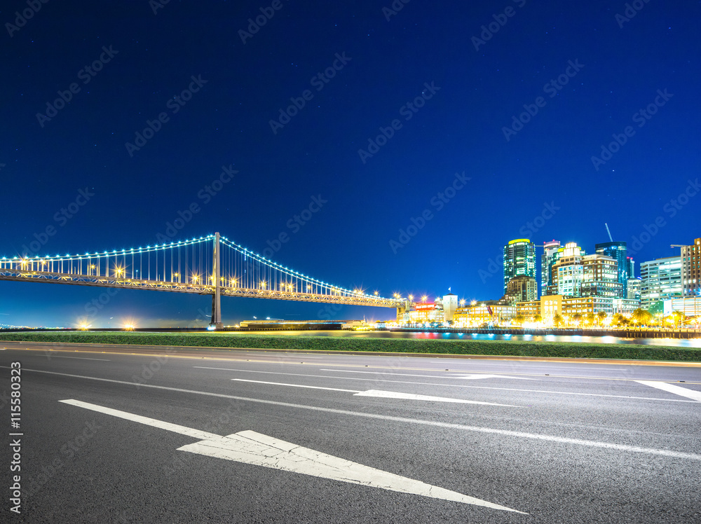 bay bridge,modern buildings in downtown of san francisco at nigh