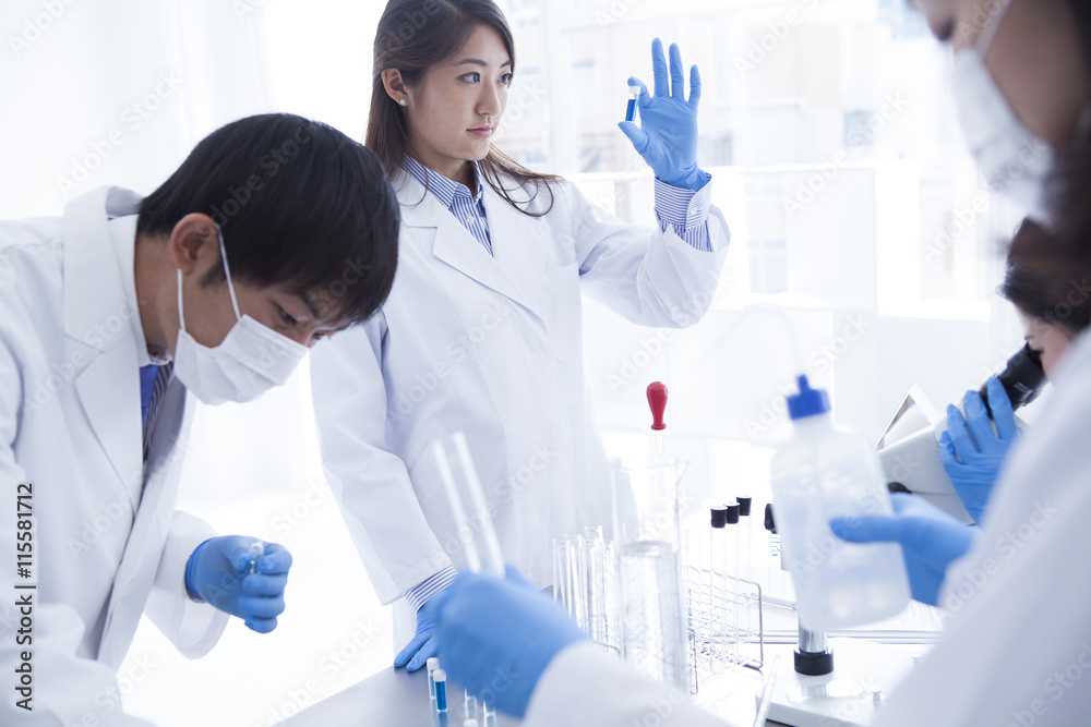 Medical researcher who is wearing a white coat