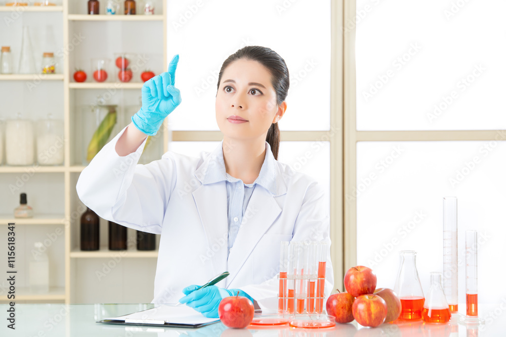 Asian female scientist drop the cure for genetic modification