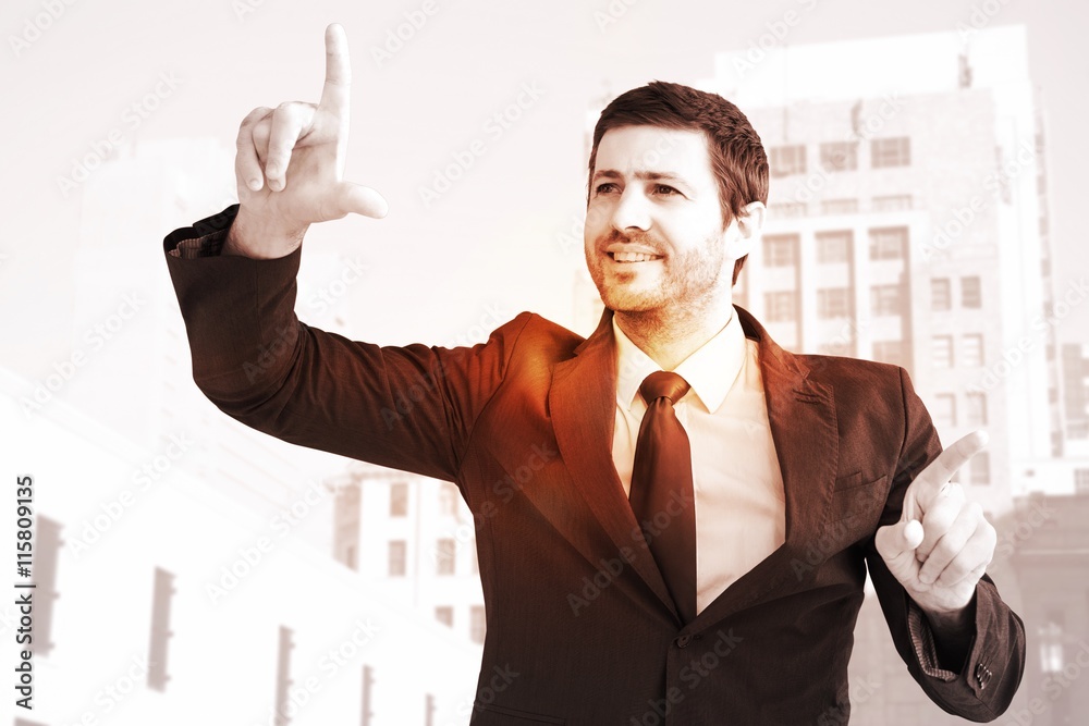 Composite image of happy businessman pointing with fingers