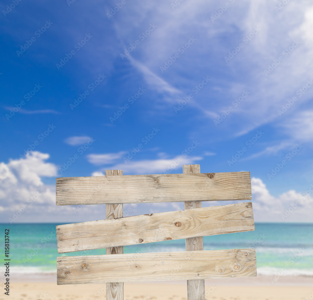 Old wooden billboard on Blured of Beautiful sea on Patong beach