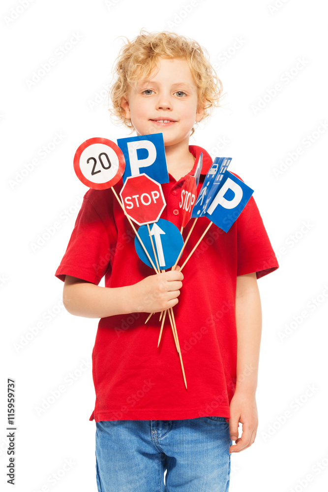 Cute boy studying traffic regulation rules