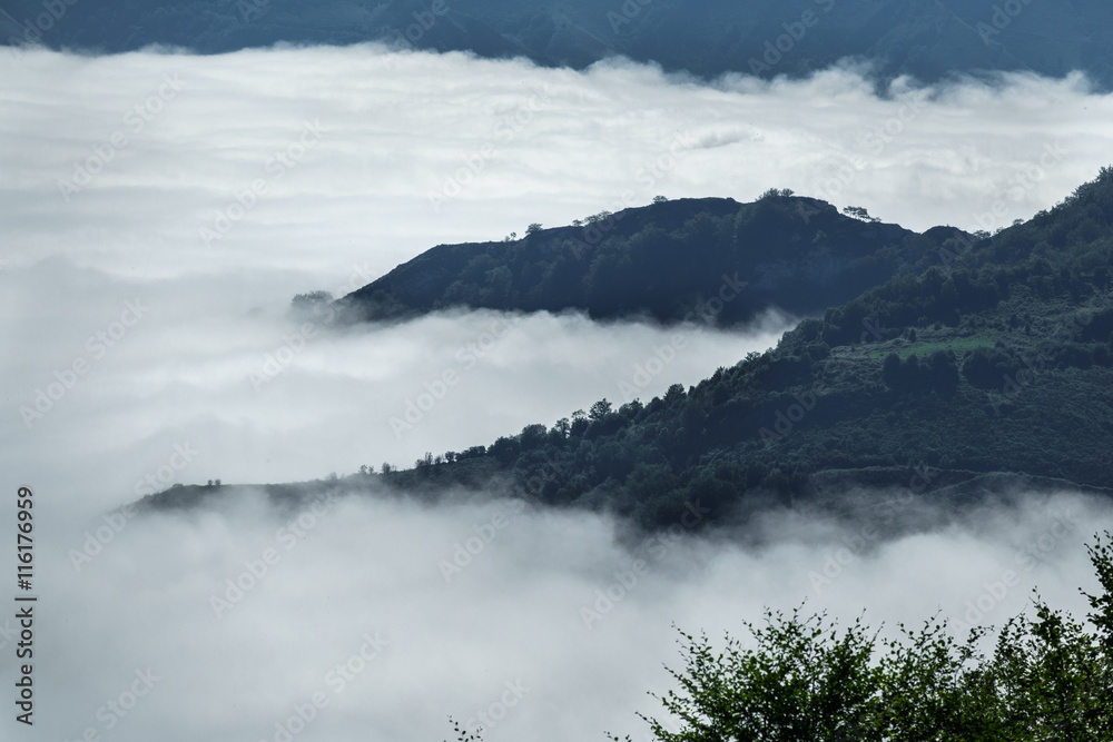 Over the clouds and fog among mountains