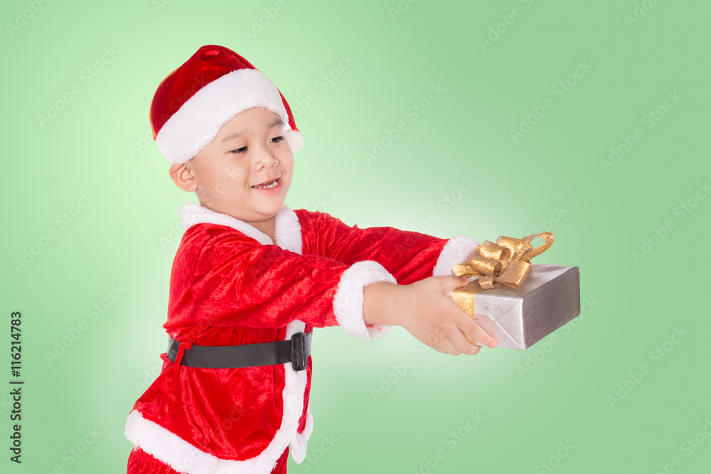 portrait of a happy little boy holding a gift