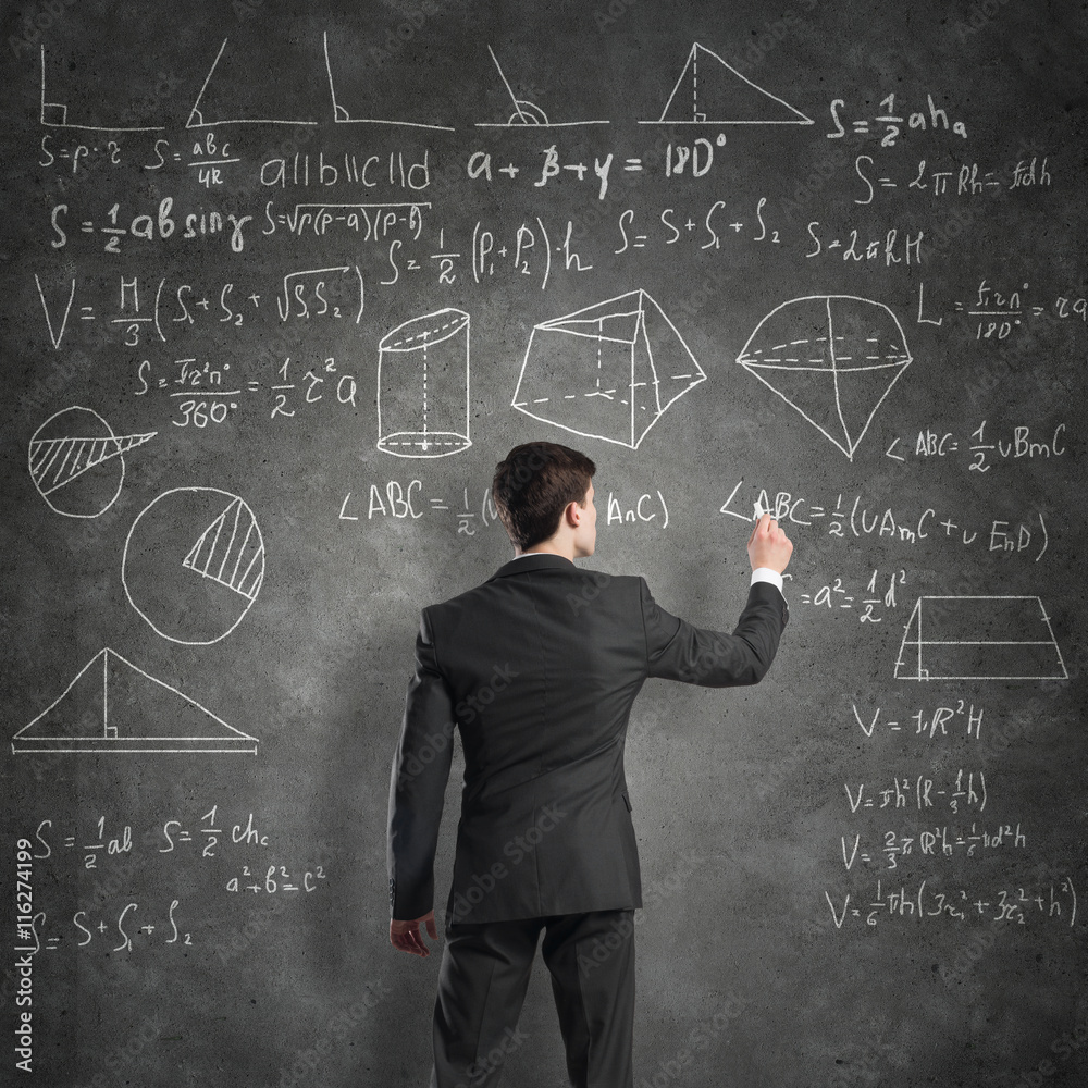 Man writing on blackboard