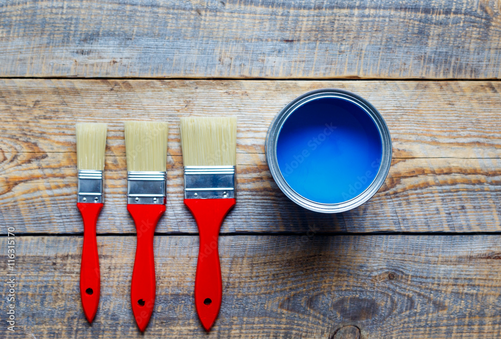 preparation for painting wooden floor at home with blue paint