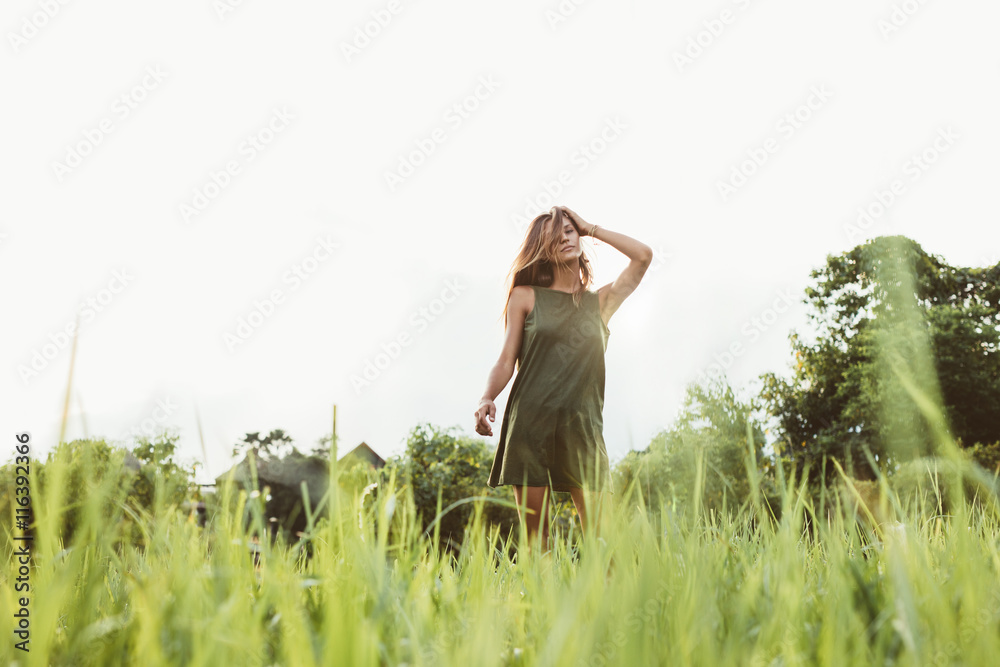 Beautiful young woman standing outdoors